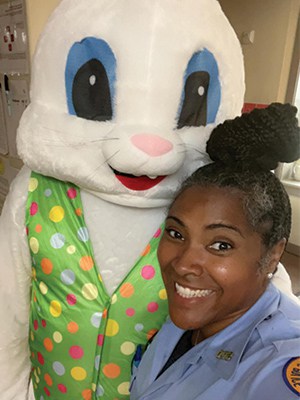 nopd officer with easter bunny wright gray