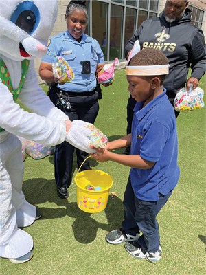 wright gray easter bunny giving candy